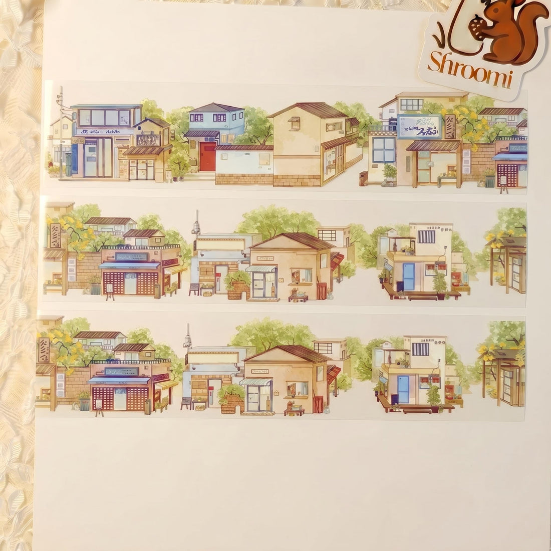 Watercolor PET tape artwork with quiet streets, small storefronts, homes, greenery, and neighborhood details