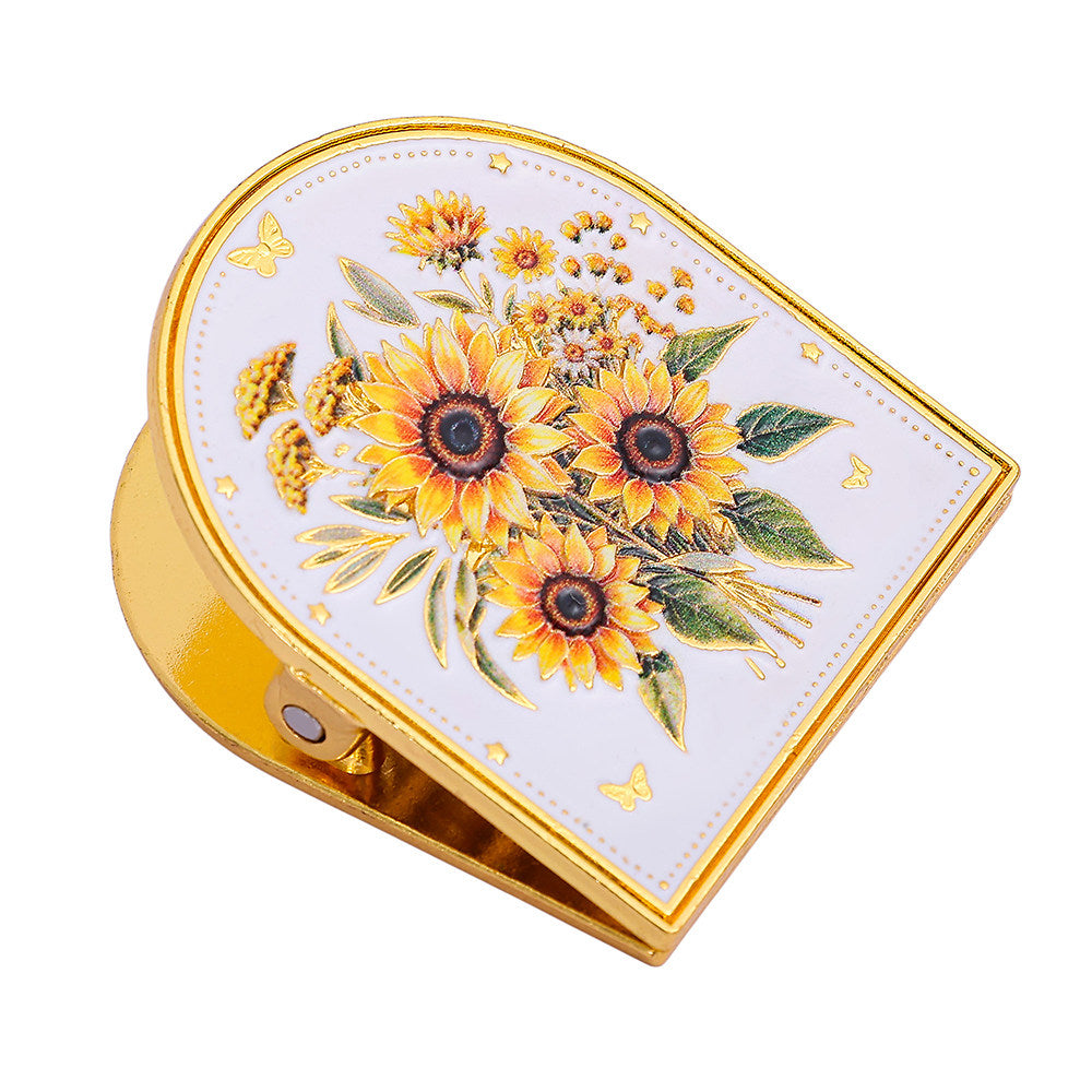 Embossed floral metal journal clip in gold-tone finish