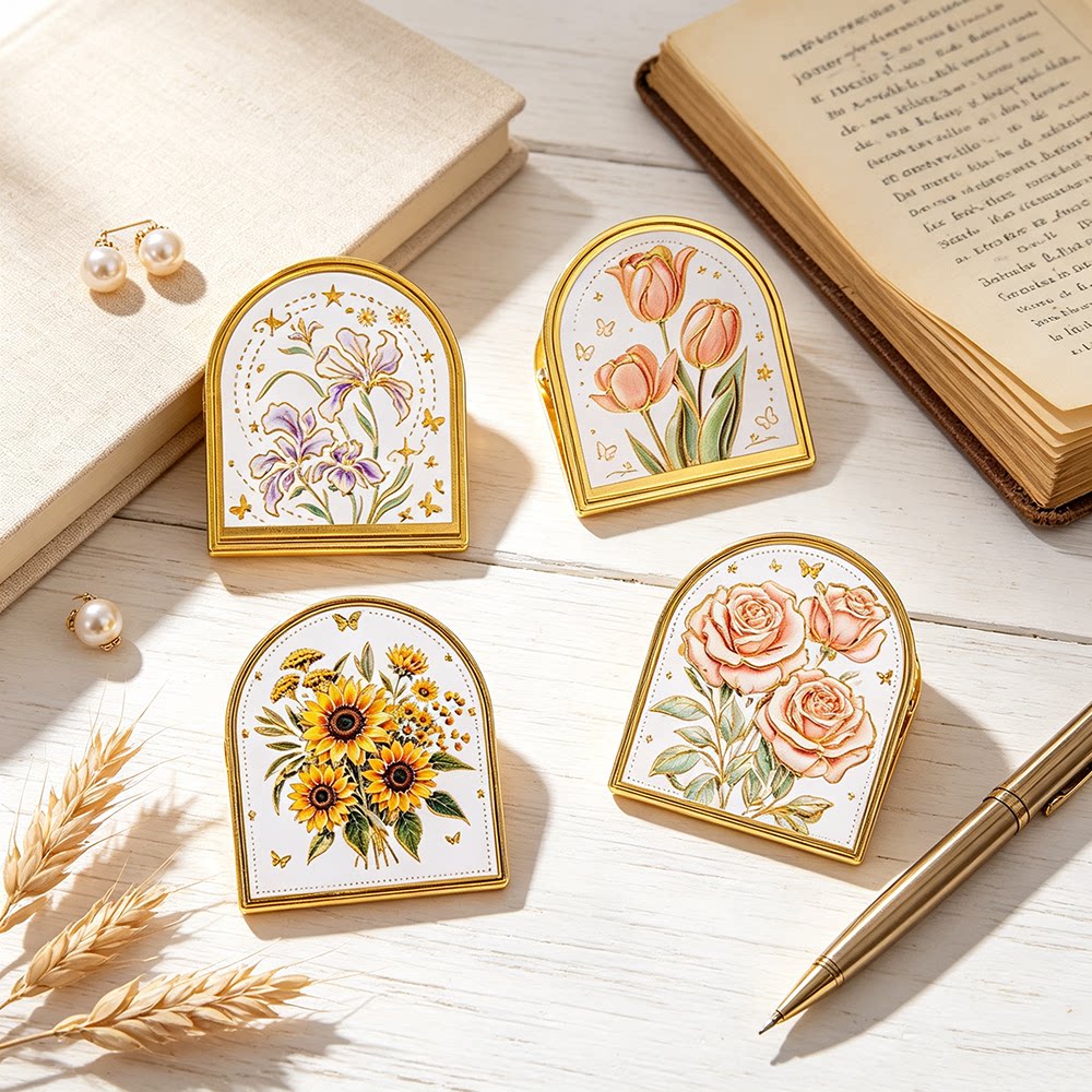 Four gold-trim enamel journal clips with embossed iris, tulip, sunflower, and rose designs