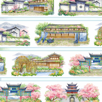 Traditional shopfronts, archways, and a water wheel in an old mountain town